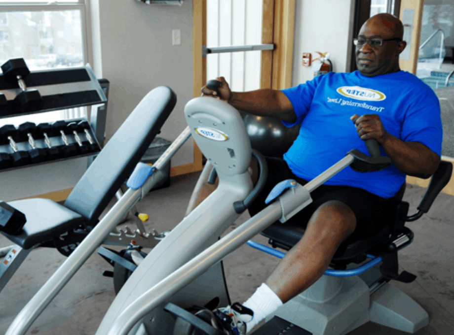 O'Neal_Hampton_exercising_on_nustep_cross_trainer