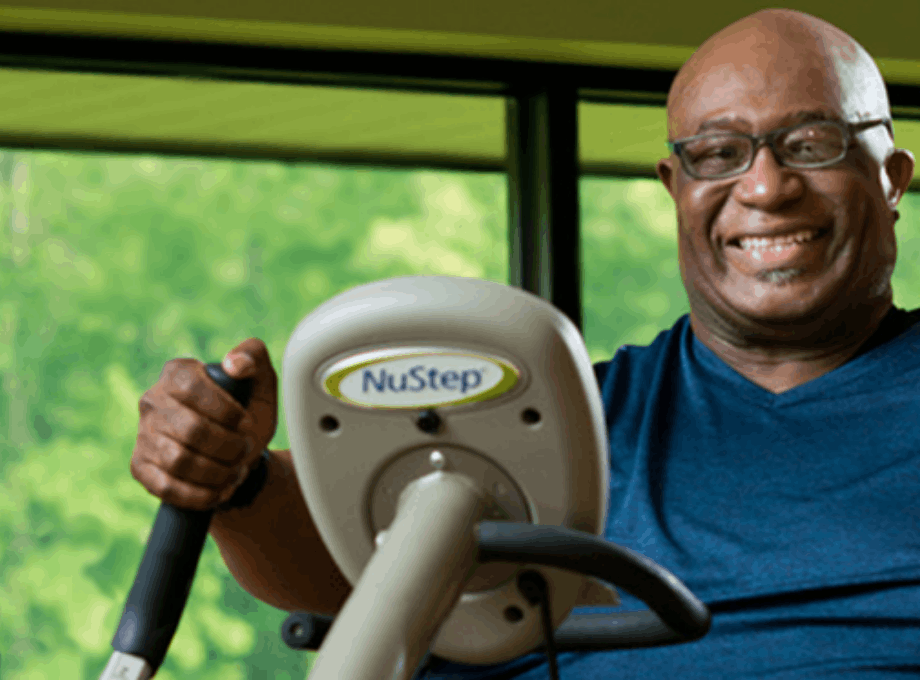 O'Neal_Hampton_Exercising_Smiling_on_NuStep_Cross_Trainer