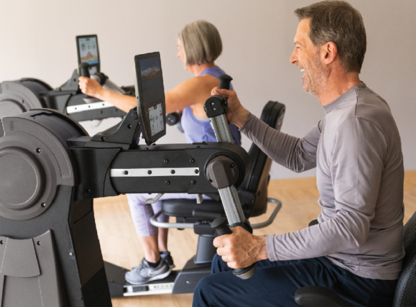 Middle Aged Male and Female Exercising Upper Body