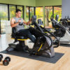 Younger Man on Seated Stepper Exercising in Home Gym Wellness Center