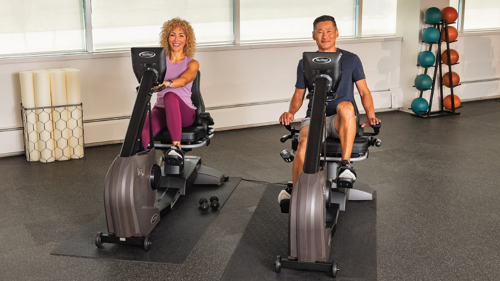 recumbent bike-woman-man-smiling-exercising